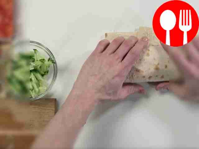 Carefully roll up the shawarma.