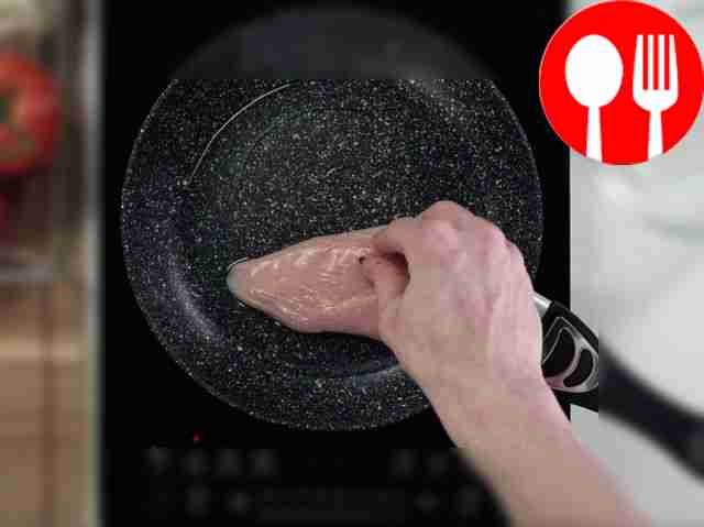 Transfer a piece of chicken fillet to a...