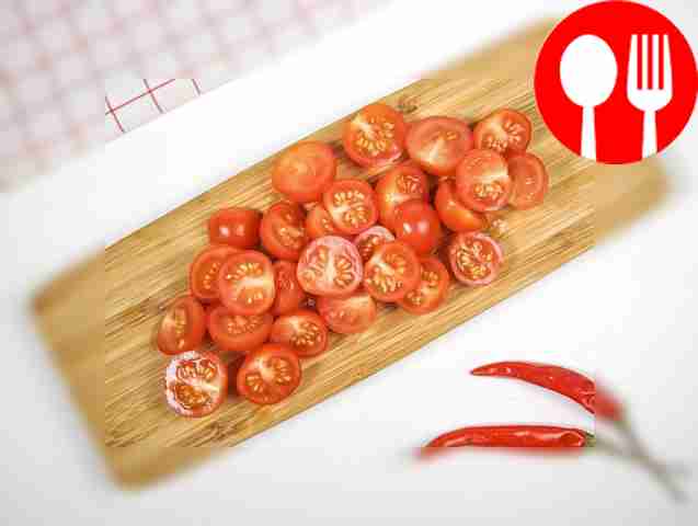 Cut cherry tomatoes into halves.