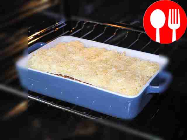 Bake chicken lasagna. Grease a baking dish...