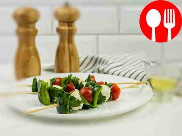 Canapes with cherry tomatoes and mozzarella