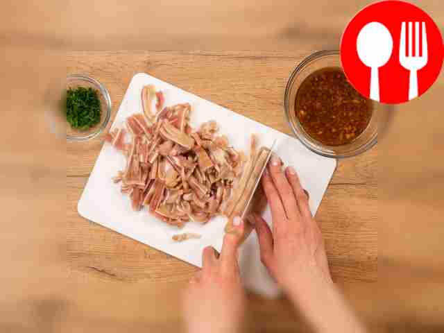 Slice the pork ears. Remove the cooked ears...