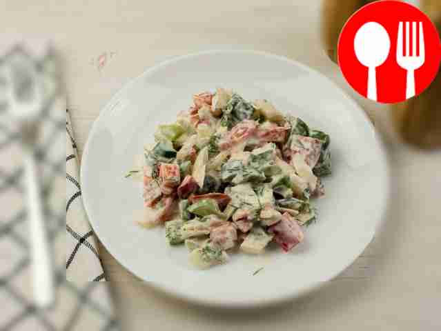 Season the salad with sour cream, salt and...
