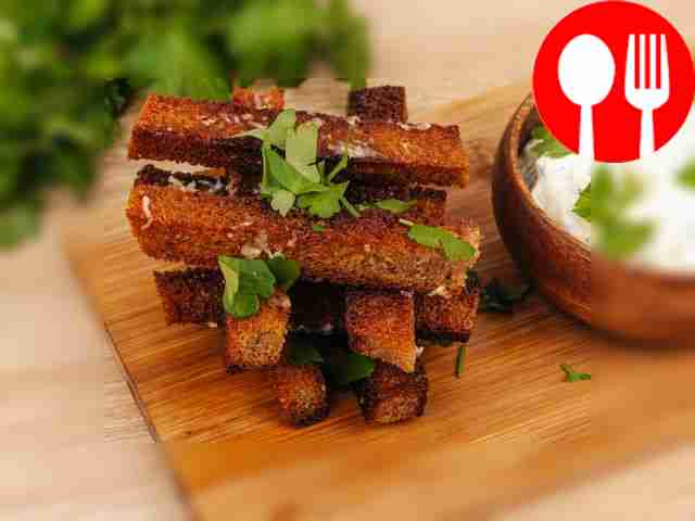 Homemade black bread croutons with garlic