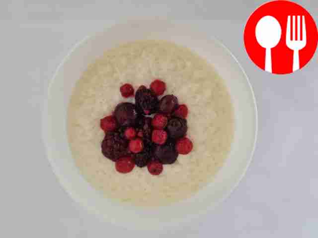 Milk soup with rice and berries