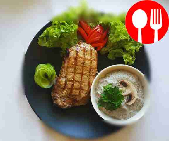 Grilled pork steak with mushroom sauce