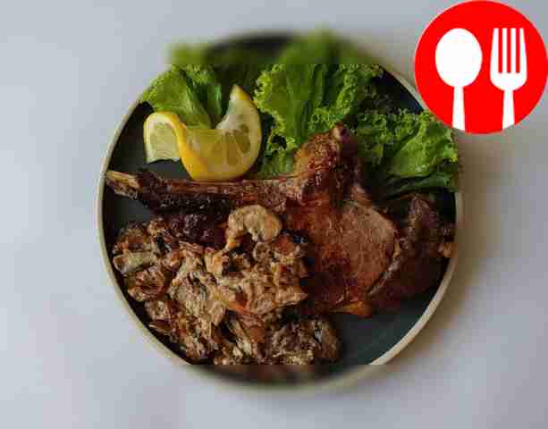 Appetizing steak on the bone with mushrooms in creamy sauce
