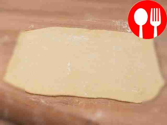 Dust the table with flour and place the dough...