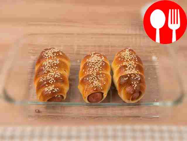 Place the sausages in the dough in the oven...