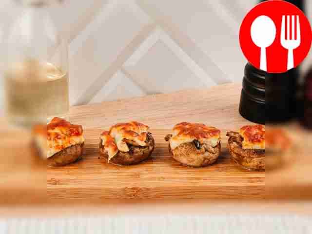 Serve the champignons hot, garnished with...