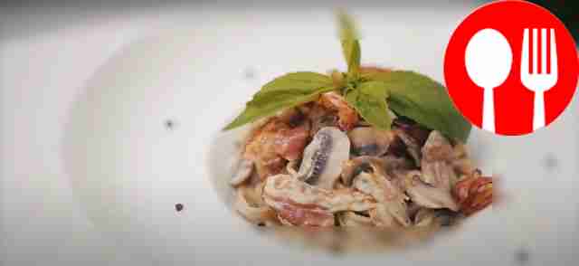 Homemade fettuccine in creamy mushroom sauce