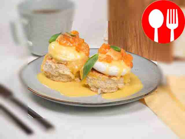 Eggs Benedict with salmon on a brioche bun