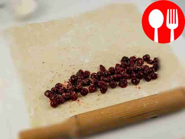 Place the berries on one edge of the dough,...