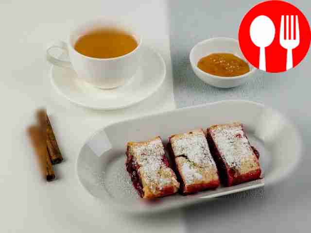 Serve the warm strudel with a scoop of ice cream.