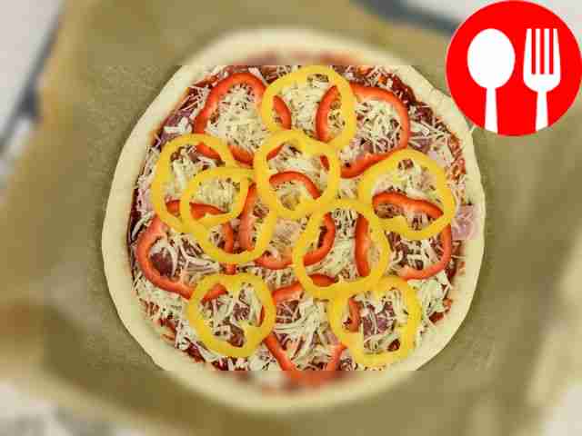 Place the pizza base on a parchment-lined...