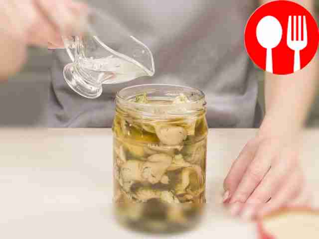 Pack the pickled oyster mushrooms for storage....