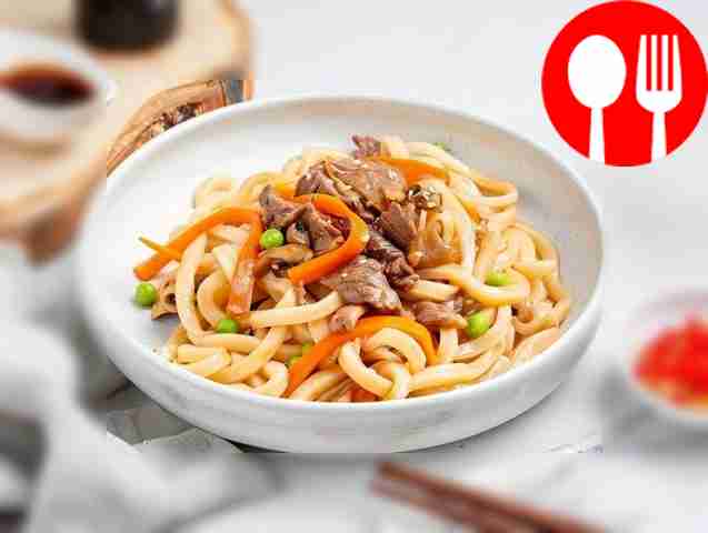 Japanese udon noodles with beef in sauce, vegetables and mushrooms