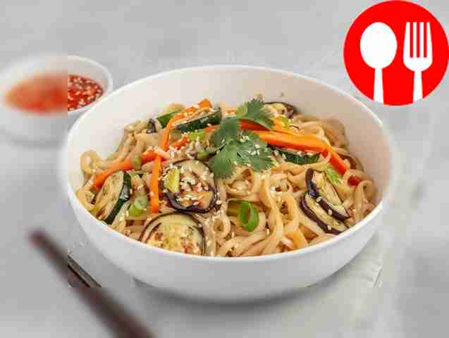 Homemade wok noodles with eggplant, bell pepper and zucchini