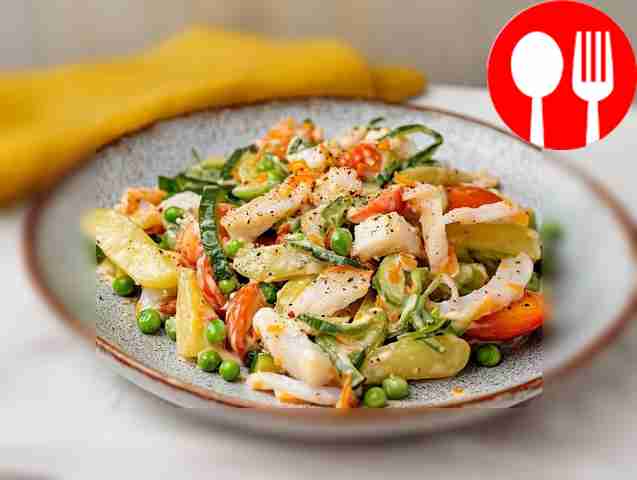 Asian salad of squid, fish and pickled cucumbers