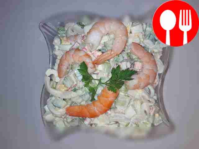 Popular sea salad with shrimp, squid and crab sticks