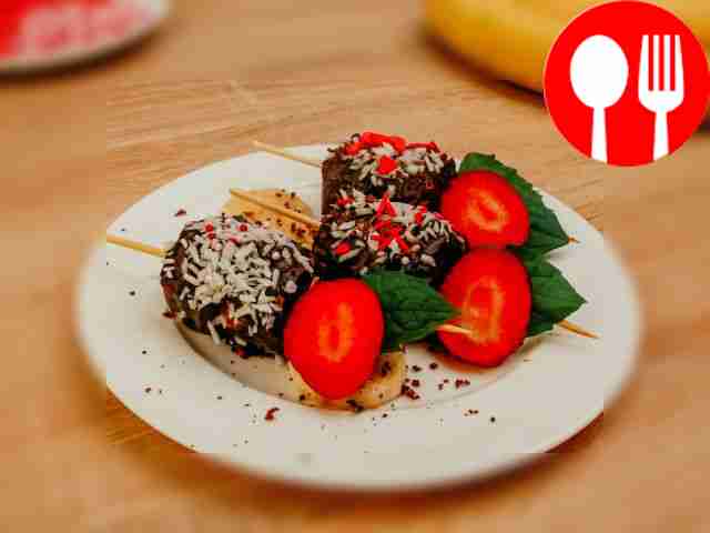 Thread chocolate covered banana onto skewers...