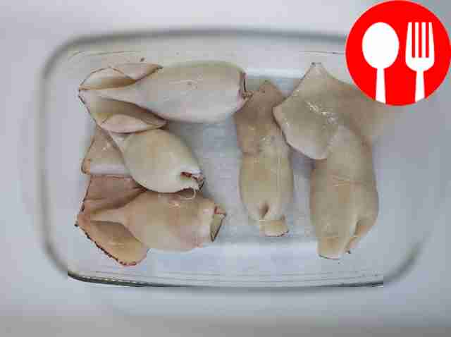 Carefully stuff the cleaned squids with the...