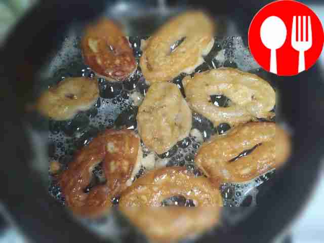 Fry the squid rings in a hot frying pan,...