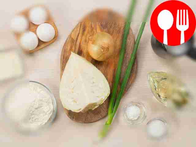 Remove the top leaves of the cabbage and cut...