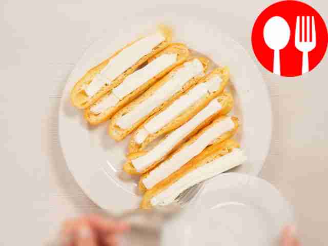 Fill the eclairs. Cut the eclair in half...