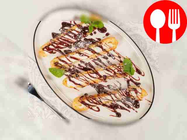 Pour chocolate sauce over the eclairs and serve.