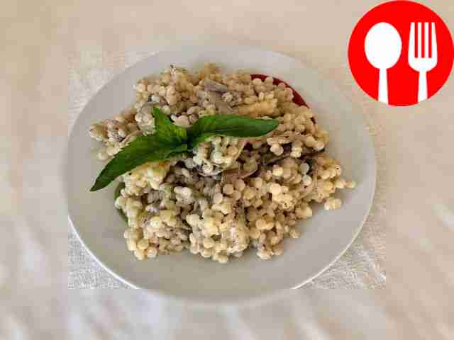 Simple delicious ptitim with mushrooms in creamy sauce