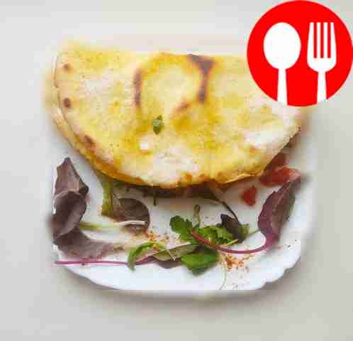 Hearty tortilla with cheese and tomatoes