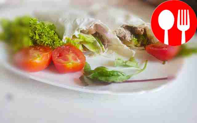 Hearty steak roll with avocado in tortilla