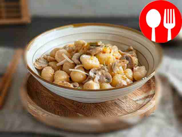 Classic gnocchi in creamy sauce with mushrooms