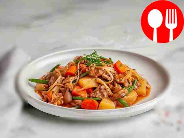 Juicy venison with vegetables in a casserole dish