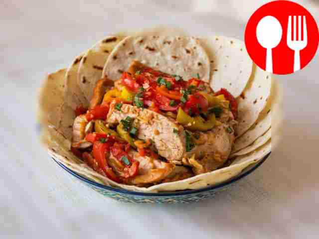 Mexican chicken fajitas with vegetables in a slow cooker