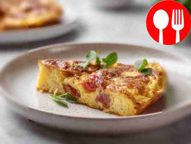 Spanish potato tortilla with tomatoes and sausage