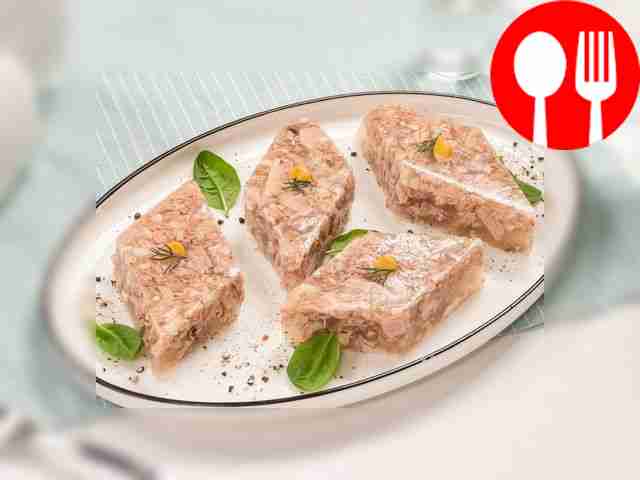 Serve the finished pork head jellied meat in...