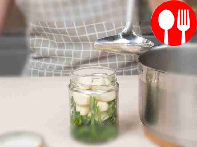 Seal the pickled garlic in the jars. Pour the...