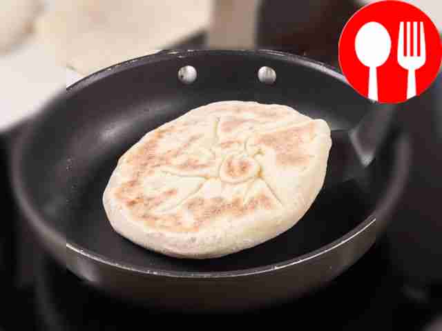Fry the tortillas in a frying pan. Heat a cast...