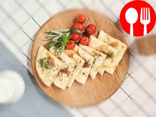 Brush the finished khychins with melted butter...