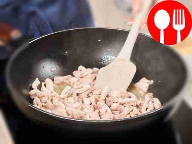 Fry the chicken meat. Place a wok on the fire,...