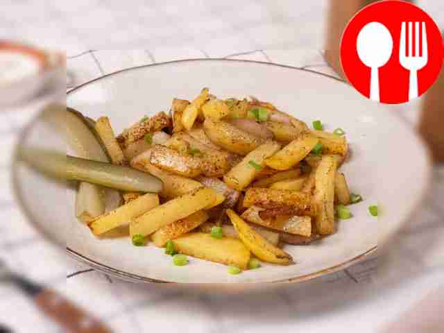 Potatoes with lard in a frying pan