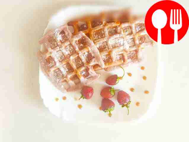 Sprinkle powdered sugar on top of the waffles...