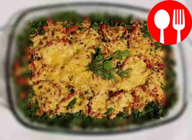 Appetizing baked meat with vegetables and mushrooms