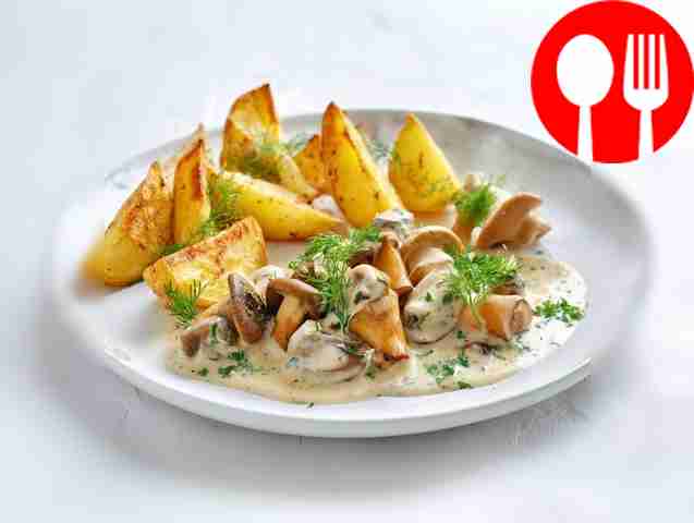 Fried boletus mushrooms with sour cream sauce