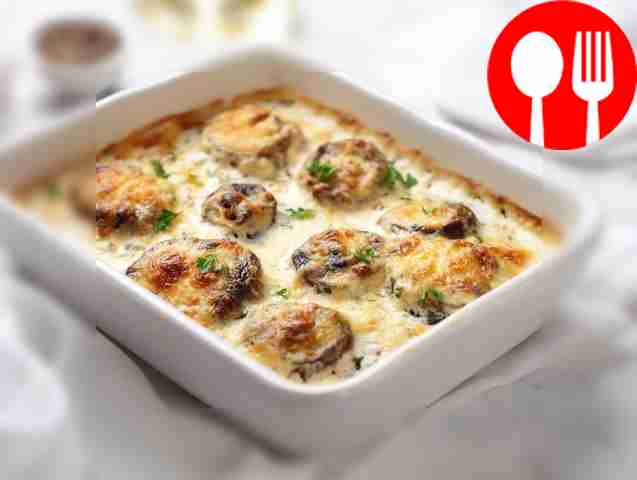 Baked boletus in sour cream sauce with cheese