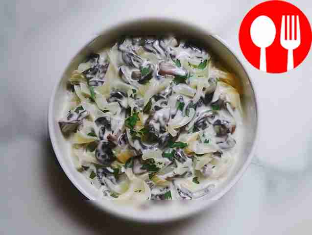 Stewed boletus mushrooms with sour cream and onions