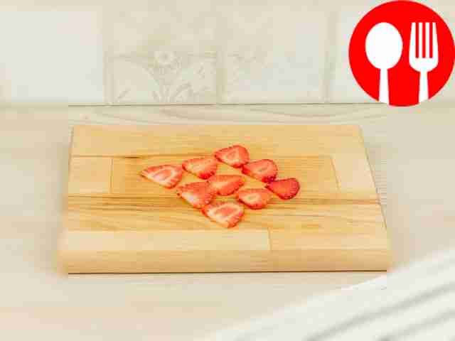 Cut off the stems of the strawberries. Cut it...