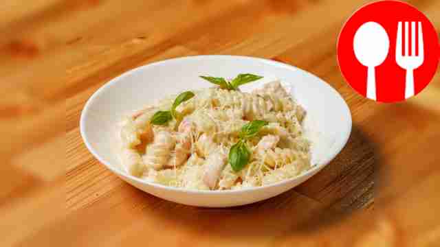 Fusilli pasta with salmon in creamy sauce